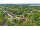 An aerial view shows a neighborhood with mature trees, showcasing the home's location at 404 Foxwood Ct, Mcdonough, GA 30253