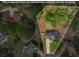 A detailed aerial view shows a house with estimated property lines, set among lush greenery at 404 Foxwood Ct, Mcdonough, GA 30253