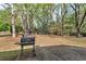 Grill and backyard surrounded by mature trees and a wooden fence at 404 Foxwood Ct, Mcdonough, GA 30253