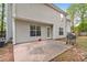 Backyard view of a home featuring a patio area, grill, and mature trees at 404 Foxwood Ct, Mcdonough, GA 30253