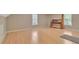 Spacious bedroom featuring hardwood floors, natural light, and a window view at 404 Foxwood Ct, Mcdonough, GA 30253