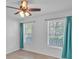 Bright bedroom features new hardwood floors, neutral paint, and plenty of natural light at 404 Foxwood Ct, Mcdonough, GA 30253