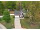A charming brick and siding home with a manicured lawn offers great curb appeal at 404 Foxwood Ct, Mcdonough, GA 30253
