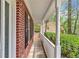 Inviting front porch with white columns and lush landscaping providing curb appeal at 404 Foxwood Ct, Mcdonough, GA 30253