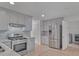 Gray kitchen with stainless steel appliances and tile floors at 404 Foxwood Ct, Mcdonough, GA 30253