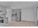 Spacious kitchen with stainless steel refrigerator, gray cabinets, and tile flooring at 404 Foxwood Ct, Mcdonough, GA 30253