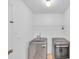 Laundry room featuring modern front load washer and dryer at 404 Foxwood Ct, Mcdonough, GA 30253