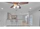 Open-concept living area featuring kitchen bar and natural light at 404 Foxwood Ct, Mcdonough, GA 30253