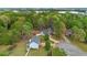 An aerial shot displays homes nestled among mature trees in a quiet neighborhood at 404 Foxwood Ct, Mcdonough, GA 30253