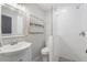 This bathroom showcases a walk-in shower with subway tile and a modern vanity at 5125 Dahlonega Hwy, Cumming, GA 30028