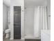Bathroom with tiled shower and a toilet at 5125 Dahlonega Hwy, Cumming, GA 30028