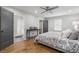 Bedroom featuring hardwood floors and an attached bathroom at 5125 Dahlonega Hwy, Cumming, GA 30028