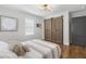 Bedroom with closet barn doors and hardwood floors at 5125 Dahlonega Hwy, Cumming, GA 30028