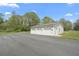 This detached three-car garage provides ample storage space for vehicles and equipment at 5125 Dahlonega Hwy, Cumming, GA 30028