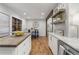 Charming kitchen featuring hardwood floors, stainless appliances and an island with butcher block countertop at 5125 Dahlonega Hwy, Cumming, GA 30028