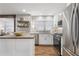 Beautiful kitchen with hardwood floors, stainless steel refrigerator, and stylish decor at 5125 Dahlonega Hwy, Cumming, GA 30028