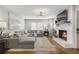 Cozy living room with fireplace, plush seating, and an abundance of natural light at 5125 Dahlonega Hwy, Cumming, GA 30028