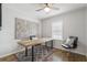 Bright office features hardwood floors, modern decor, and natural light from the window at 5125 Dahlonega Hwy, Cumming, GA 30028