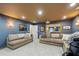Cozy basement with comfortable seating, projector screen, and recessed lighting at 5334 Lake View Clb, Atlanta, GA 30338