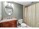 Well-maintained bathroom featuring a vanity with a granite countertop and a shower at 5334 Lake View Clb, Atlanta, GA 30338