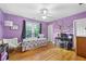 Charming bedroom with hardwood floors, natural light, and a decorative tree mural at 5334 Lake View Clb, Atlanta, GA 30338