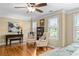 Bright bedroom with hardwood floors, ceiling fan, and decorative accents at 5334 Lake View Clb, Atlanta, GA 30338