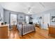 Comfortable bedroom with hardwood floors, natural light, and calming blue walls at 5334 Lake View Clb, Atlanta, GA 30338