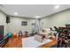 Bright exercise room with hardwood floors, workout equipment, and natural light at 5334 Lake View Clb, Atlanta, GA 30338