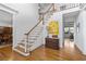Elegant foyer featuring a staircase, hardwood floors, and stylish decor at 5334 Lake View Clb, Atlanta, GA 30338