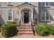 Inviting front door with decorative wreath, framed by columns and lush greenery at 5334 Lake View Clb, Atlanta, GA 30338