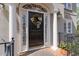 Charming front door with decorative wreath, framed by columns and lush greenery at 5334 Lake View Clb, Atlanta, GA 30338