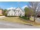 View of home showing manicured lawn and tidy landscaping with mature shade tree at 5334 Lake View Clb, Atlanta, GA 30338