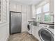 Laundry area featuring a washer, dryer, and storage, providing convenience and organization at 5334 Lake View Clb, Atlanta, GA 30338