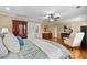 Spacious bedroom with hardwood floors, ceiling fan, and classic wooden furniture at 5334 Lake View Clb, Atlanta, GA 30338