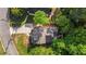 Aerial shot showcases the home's layout, driveway, and surrounding landscaping at 3527 Clare Cottage Sw Trce, Marietta, GA 30008