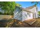 A home's backyard is shown with a small garden plot and newly installed wooden fence at 3527 Clare Cottage Sw Trce, Marietta, GA 30008