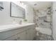 Stylish bathroom features marble-look tile in shower, decorative floor tiles and gray vanity with white countertop at 3527 Clare Cottage Sw Trce, Marietta, GA 30008