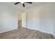 Bright bedroom features hardwood floors, white walls, closet, and an open door to the stairway at 3527 Clare Cottage Sw Trce, Marietta, GA 30008