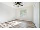 Comfortable bedroom with ceiling fan, closet, and a bright window at 3527 Clare Cottage Sw Trce, Marietta, GA 30008