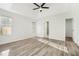 Bright main bedroom with ensuite bathroom access and wood-look flooring at 3527 Clare Cottage Sw Trce, Marietta, GA 30008