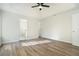 Well-lit bedroom featuring ensuite bathroom access and wood-look flooring at 3527 Clare Cottage Sw Trce, Marietta, GA 30008