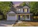 Charming two-story home with white siding, black shutters, and a well-manicured front yard at 3527 Clare Cottage Sw Trce, Marietta, GA 30008