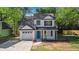 Charming two-story home with white siding, black shutters, and a well-manicured front yard at 3527 Clare Cottage Sw Trce, Marietta, GA 30008
