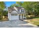 Charming two-story home with white siding, black shutters, and a well-manicured front yard at 3527 Clare Cottage Sw Trce, Marietta, GA 30008