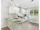 Modern kitchen showcasing granite countertops, stainless steel appliances, and contemporary pendant lighting at 3527 Clare Cottage Sw Trce, Marietta, GA 30008