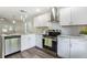 Well-lit kitchen with stainless steel appliances, granite countertops, and white subway tile backsplash at 3527 Clare Cottage Sw Trce, Marietta, GA 30008