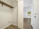 Small laundry room featuring hardwood floors, a shelf, and washer dryer hookups at 3527 Clare Cottage Sw Trce, Marietta, GA 30008