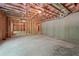 Unfinished basement featuring exposed beams and concrete foundation, ready for customization at 3930 Clifton Hill Court #15, Cumming, GA 30040