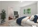 Bright bedroom with a view of the backyard and ensuite bath at 3930 Clifton Hill Court #15, Cumming, GA 30040