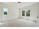 Bright bedroom with carpet floors, modern window frames, and natural light at 3930 Clifton Hill Court #15, Cumming, GA 30040